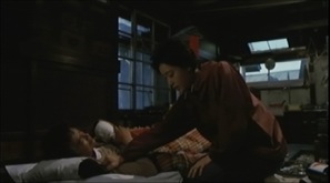 Ken Ogata et Masako Natsume dans Gyoei no mure (1983)